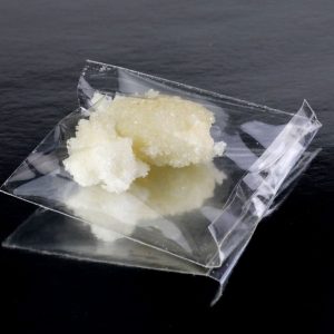 Sealed transparent pack containing crack cocaine, showcasing its purity and secure packaging.