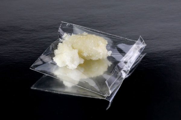 Sealed transparent pack containing crack cocaine, showcasing its purity and secure packaging.