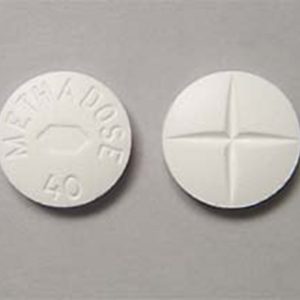 Front and back view of Methadose oral tablet on a clean surface, showcasing its appearance and packaging for informational purposes. Methadose Oral Tablet