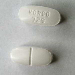 Front and back view of Norco oral tablet displayed on a clean surface, showing the pill's markings and shape.