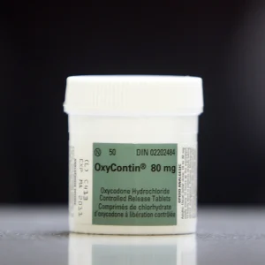 OxyContin 80 mg tablets in a sealed container.