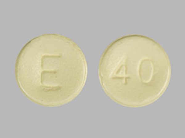 Opana ER Oral Tablet front and back view on a clean surface.